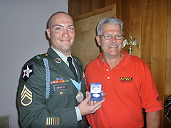 Minneapolis Area Local President Jerry Sirois presents Kevin Imholte with a medallion on behalf of the APWU. Minneapolis Area Local President Jerry Sirois presents Kevin Imholte with a medallion on behalf of the APWU.