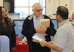 Redwood Empire Area Local Secretary-Treasurer Tracy Blakely (left) and President David Ospital speak to a Staples manager.