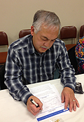 Larry Mathews and Judy Popp sign up to join the Kansas City Golden Jazz Retiree Chapter.