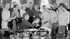 Assistant Secretary of Labor Esther Peterson (far left) watches as President Kennedy signs the Equal Pay Act into law. As the JFK administration's highest ranking female official, she led the fight to pass legislation establishing the principle of equal pay for equal work.