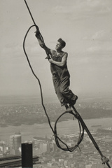 A worker climbs a cable near the top of the Empire State building. (George Eastman House, International Museum of Photography and Film )