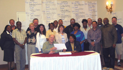 Hal Stack, director of the Labor Studies Center at Wayne State, and Joyce Robinson, backed by attendees of the APWU’s first leadership development program.
