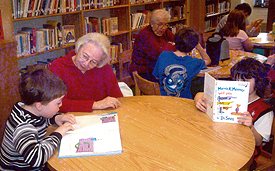 Pictured is Elsie McHale, retired Window Clerk from the Kintnersville and Doylestown, PA Post Offices, volunteering with second graders from the Durham Nocks Grammar school. 