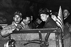 Eleanor Roosevelt tours an underground coal mine with union officials, 1935.