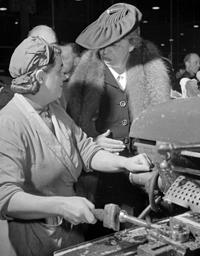 ER talks to a woman defense worker.