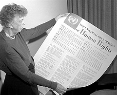 ER displays the United Nations' Universal Declaration of Human Rights, which she helped pass. The document proclaims, “everyone has the right to form and to join trade unions.