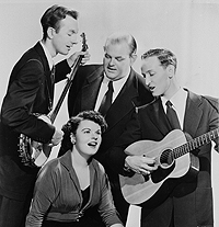 The Weavers in the early 1950s: From left are Pete Seeger, Lee Hays, and Fred Hellerman, with Ronnie Gilbert in the foreground.
