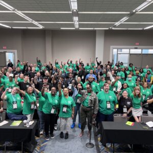 a group of APWU members raising their fists!