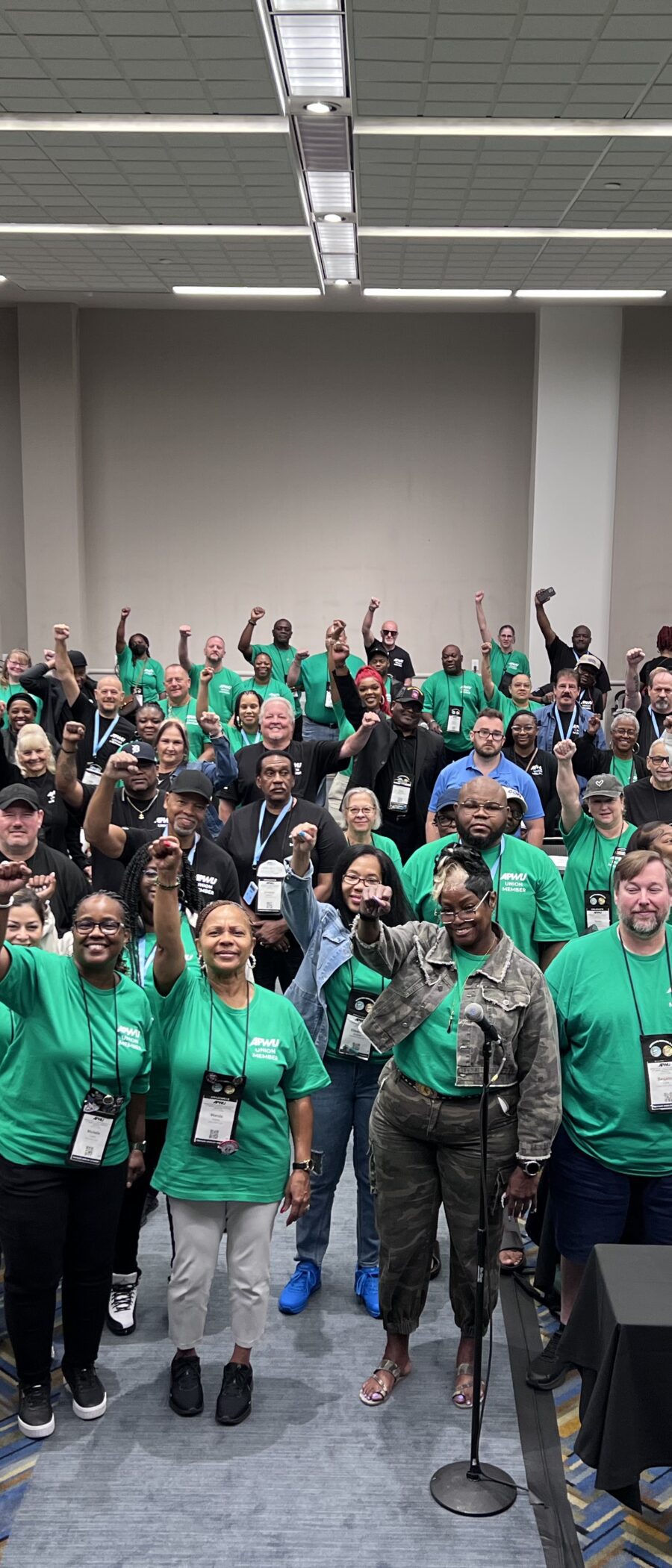 a group of APWU members raising their fists!