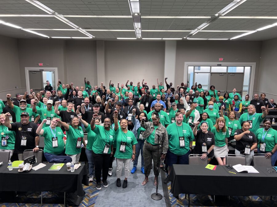a group of APWU members raising their fists!