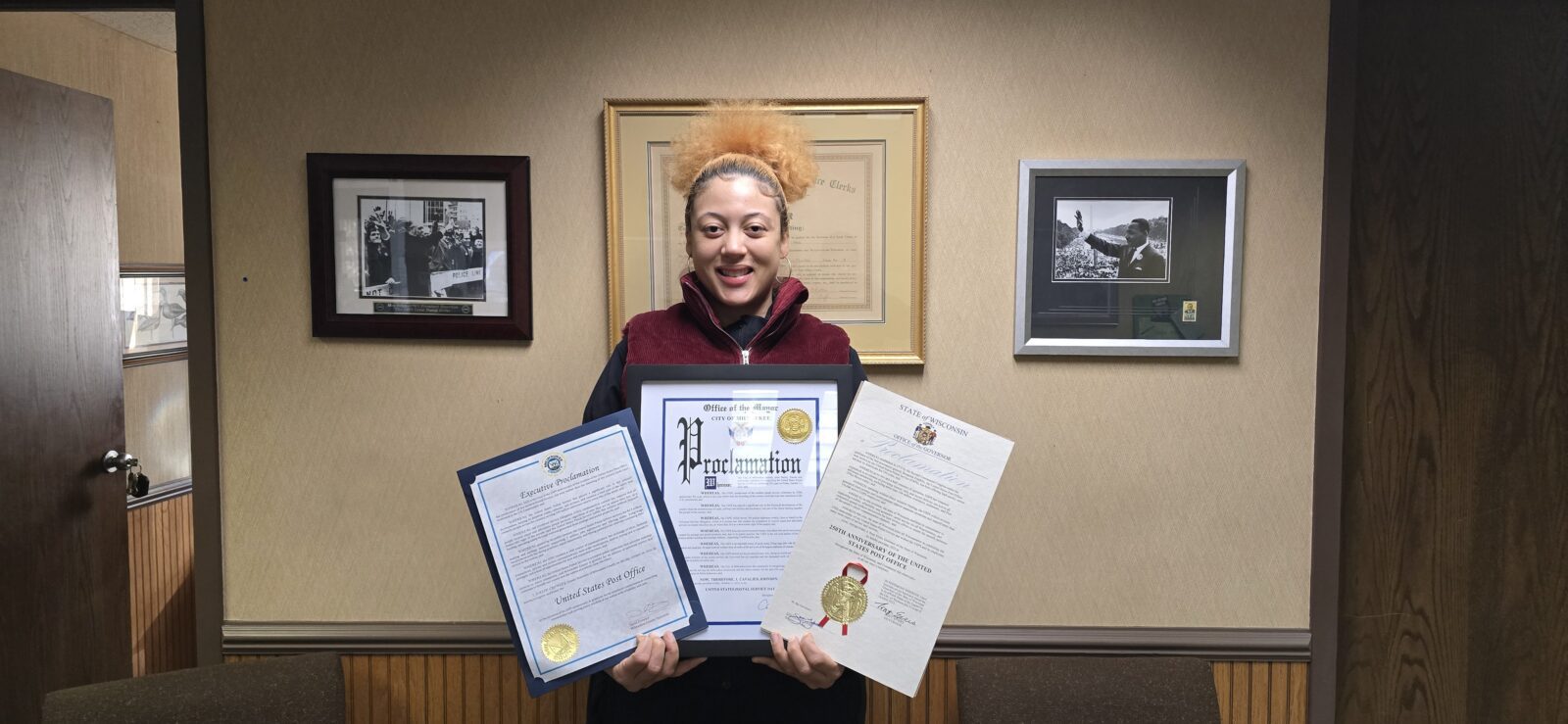 A photo of Milwaukee steward holding the signed proclamations